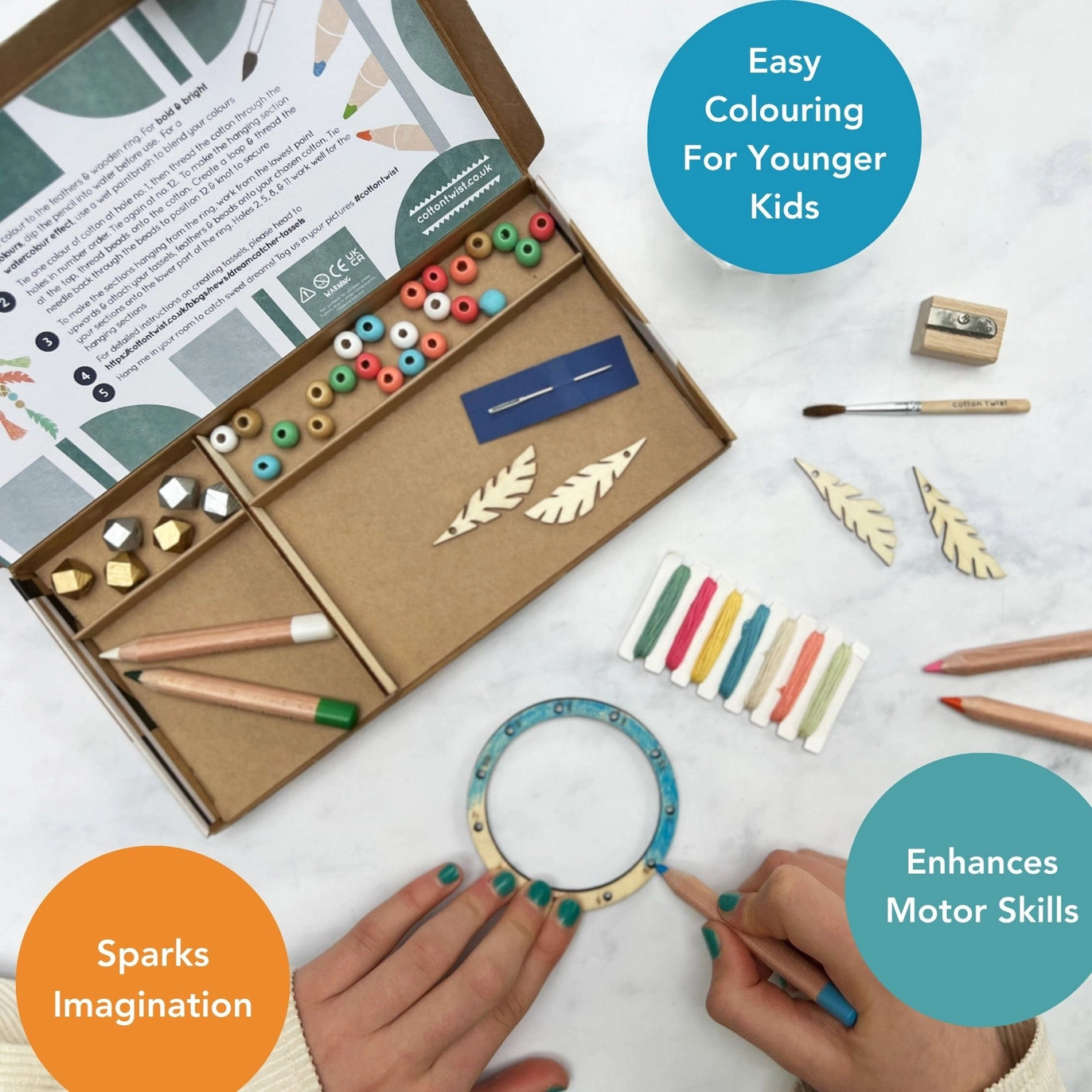 Children's art kit with tools and materials on a white surface, featuring text about its benefits.
